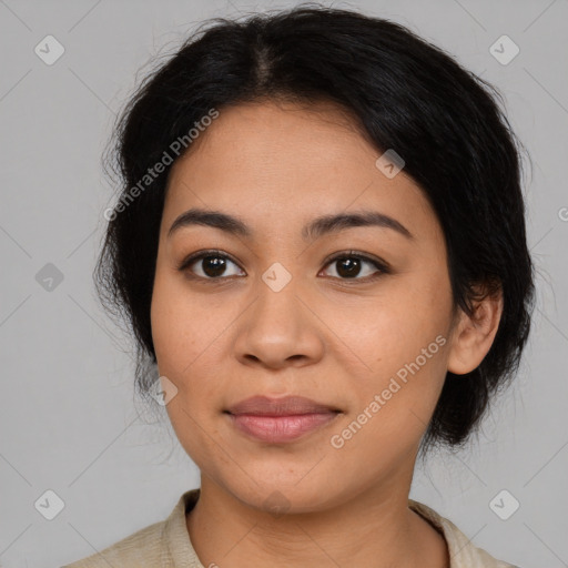 Joyful asian young-adult female with medium  black hair and brown eyes