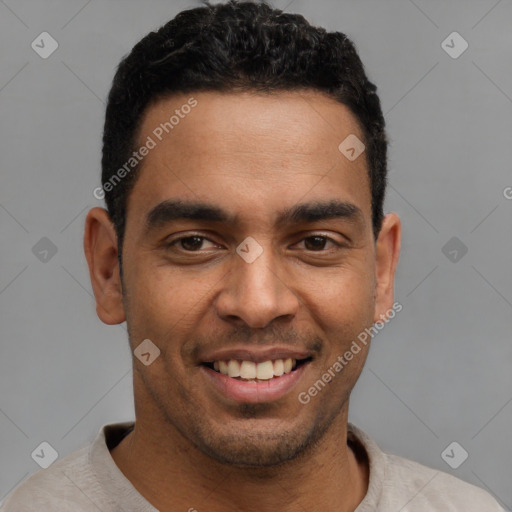 Joyful latino young-adult male with short  black hair and brown eyes