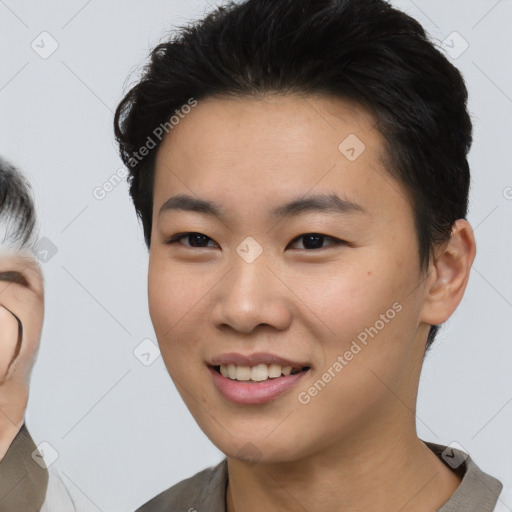 Joyful asian young-adult female with short  brown hair and brown eyes