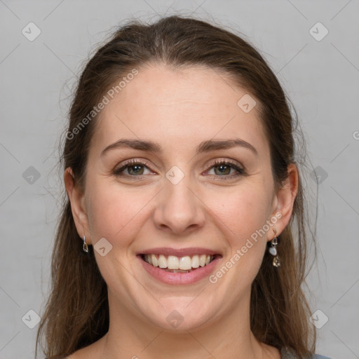 Joyful white young-adult female with medium  brown hair and grey eyes