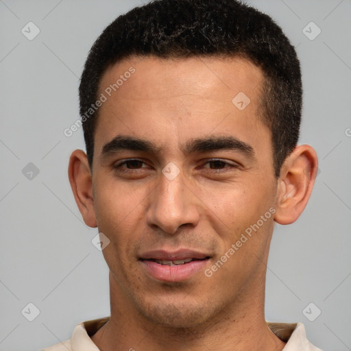 Joyful white young-adult male with short  black hair and brown eyes