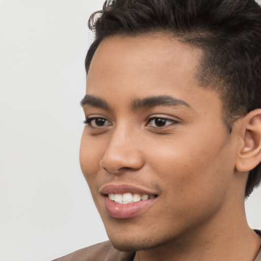 Joyful latino young-adult male with short  brown hair and brown eyes