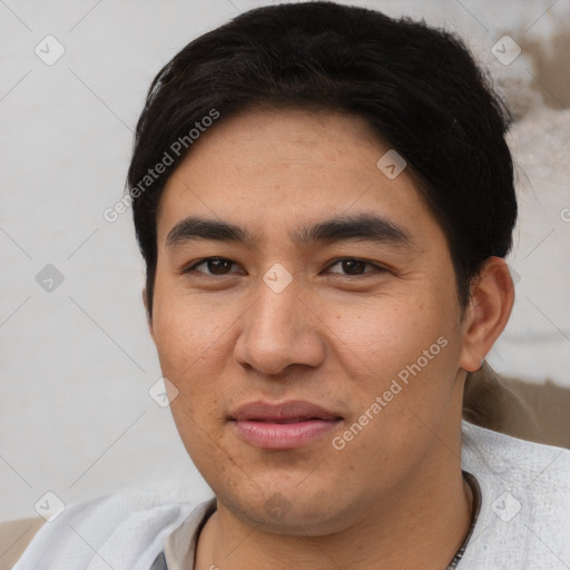 Joyful asian young-adult male with short  black hair and brown eyes