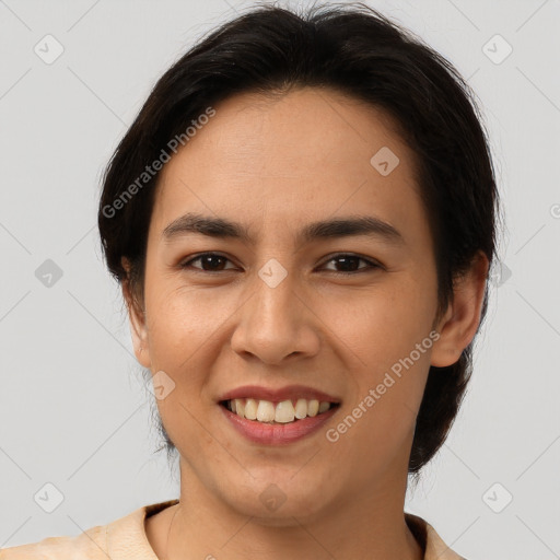 Joyful latino young-adult female with short  brown hair and brown eyes