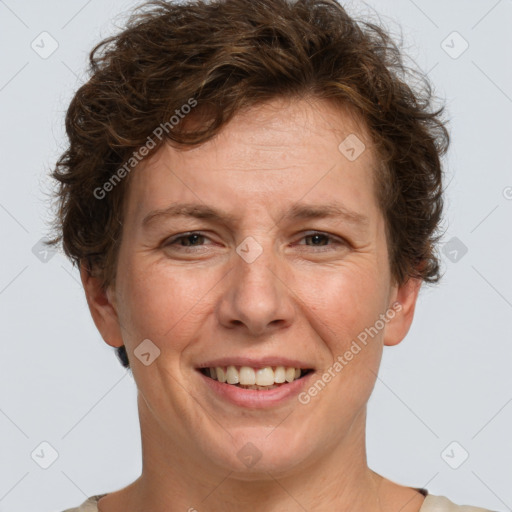 Joyful white adult female with short  brown hair and brown eyes