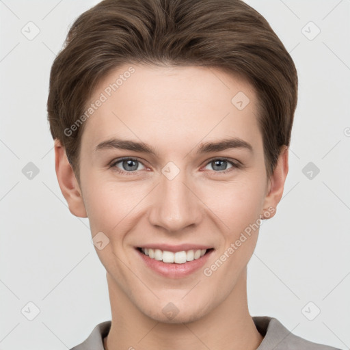 Joyful white young-adult female with short  brown hair and grey eyes