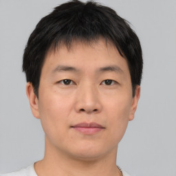 Neutral asian young-adult male with short  brown hair and brown eyes