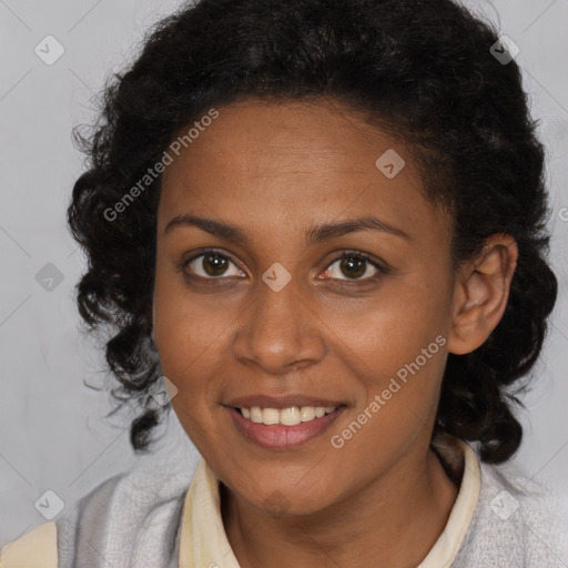 Joyful black young-adult female with medium  brown hair and brown eyes