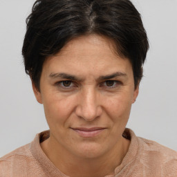 Joyful white adult female with short  brown hair and brown eyes