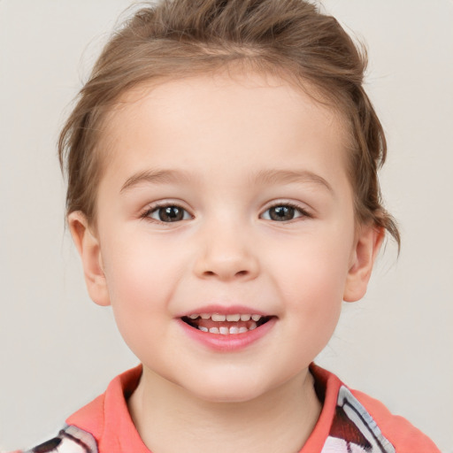 Joyful white child female with short  brown hair and brown eyes