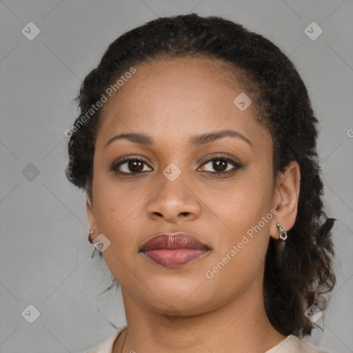 Joyful black young-adult female with medium  brown hair and brown eyes