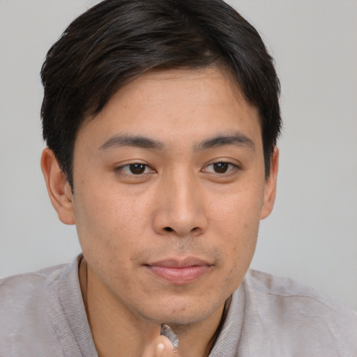 Neutral asian young-adult male with short  brown hair and brown eyes