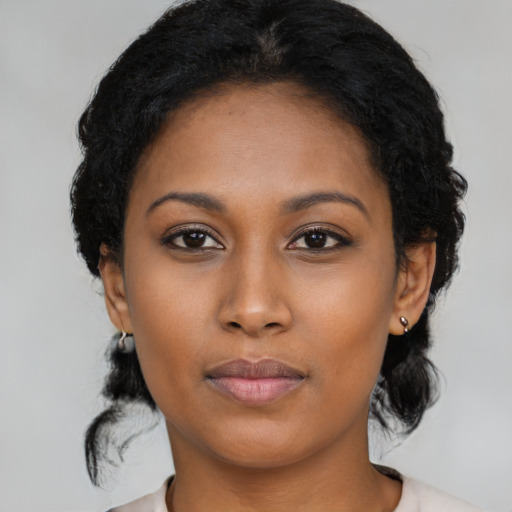 Neutral black young-adult female with medium  black hair and brown eyes