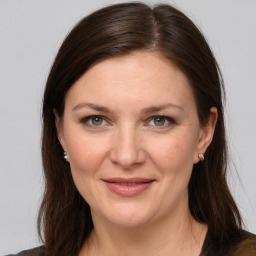 Joyful white young-adult female with long  brown hair and grey eyes