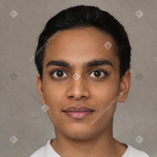 Joyful latino young-adult male with short  black hair and brown eyes