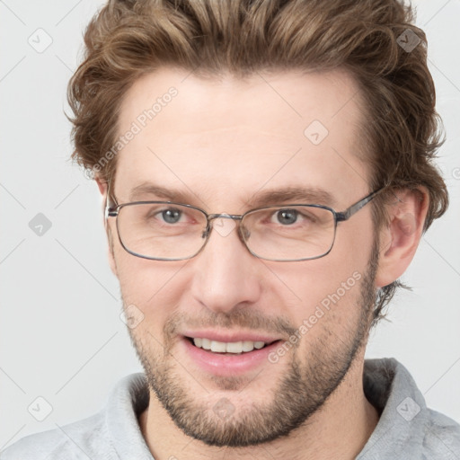 Joyful white adult male with short  brown hair and grey eyes