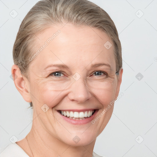 Joyful white adult female with short  brown hair and grey eyes