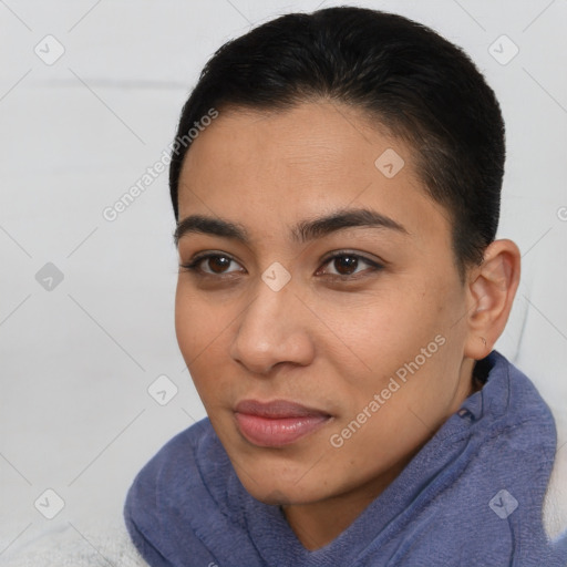 Joyful latino young-adult female with short  brown hair and brown eyes