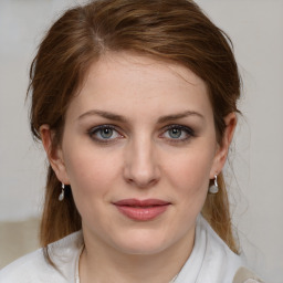 Joyful white young-adult female with medium  brown hair and blue eyes