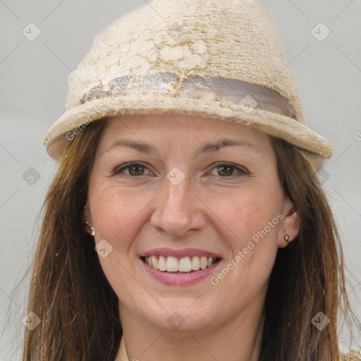 Joyful white adult female with long  brown hair and brown eyes