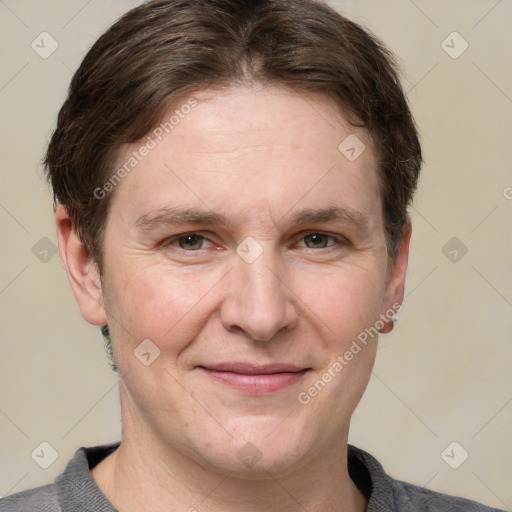 Joyful white adult male with short  brown hair and grey eyes