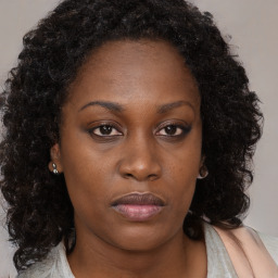 Neutral black young-adult female with long  brown hair and brown eyes