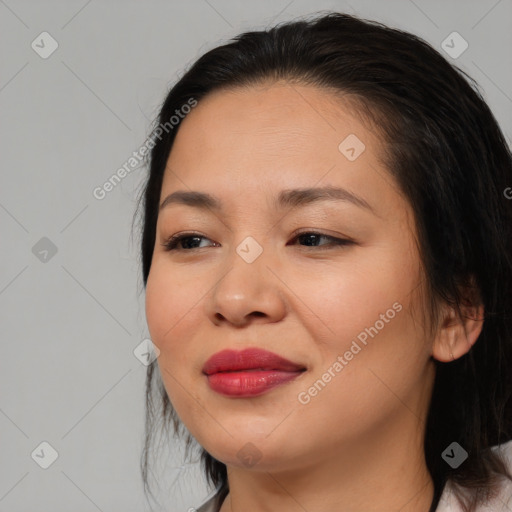 Joyful asian young-adult female with medium  brown hair and brown eyes