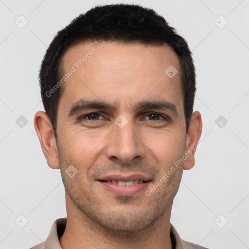 Joyful white young-adult male with short  brown hair and brown eyes