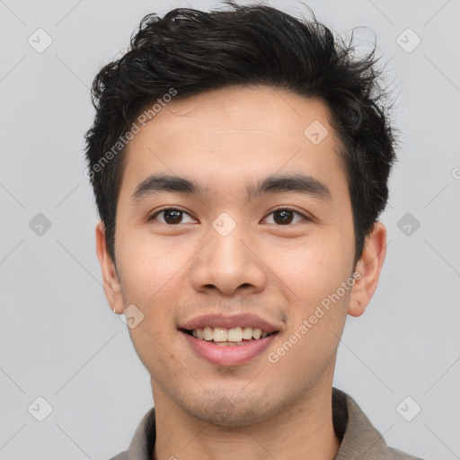 Joyful asian young-adult male with short  brown hair and brown eyes