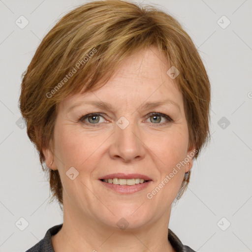 Joyful white adult female with medium  brown hair and grey eyes