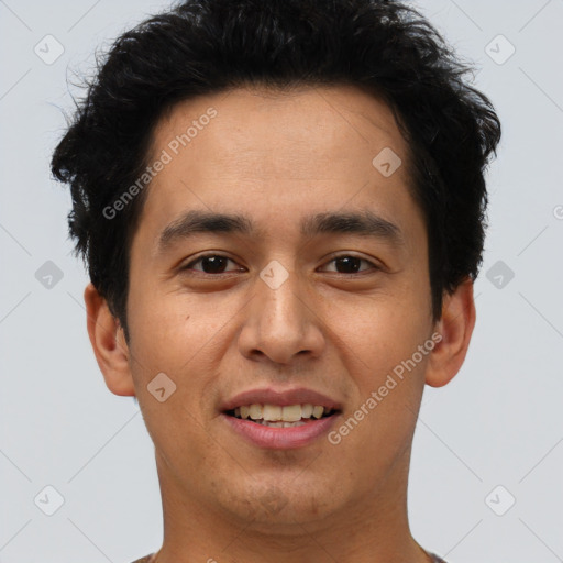 Joyful latino young-adult male with short  brown hair and brown eyes