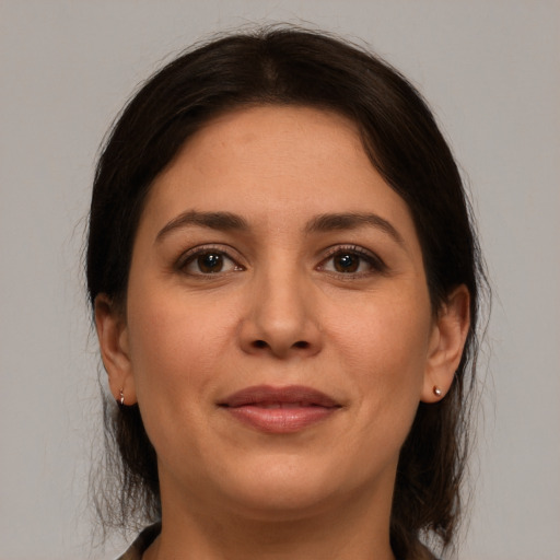 Joyful white young-adult female with medium  brown hair and brown eyes