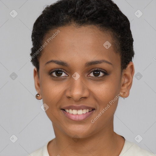 Joyful black young-adult female with short  brown hair and brown eyes