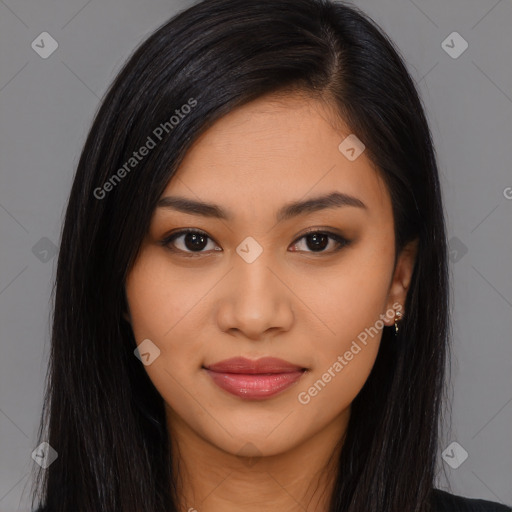 Joyful latino young-adult female with long  brown hair and brown eyes