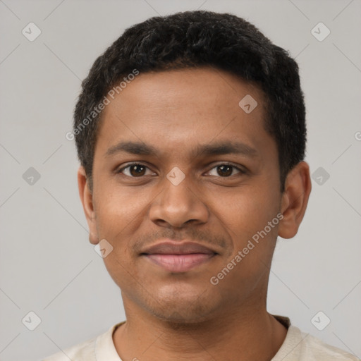 Joyful black young-adult male with short  black hair and brown eyes