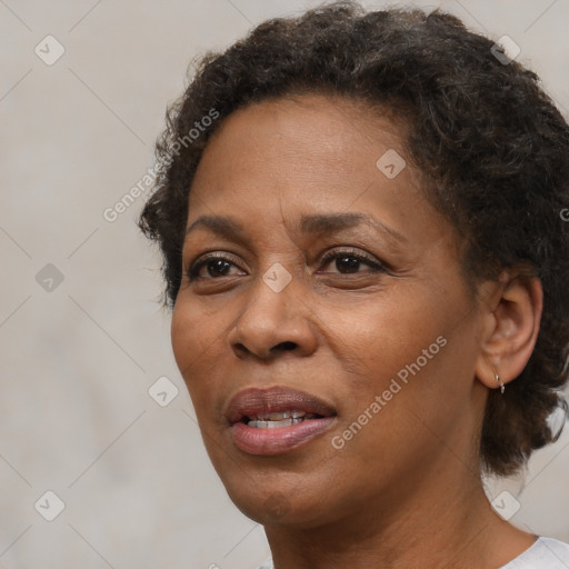 Joyful black adult female with short  brown hair and brown eyes