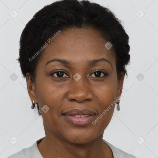 Joyful black adult female with short  brown hair and brown eyes