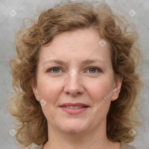 Joyful white young-adult female with medium  brown hair and blue eyes