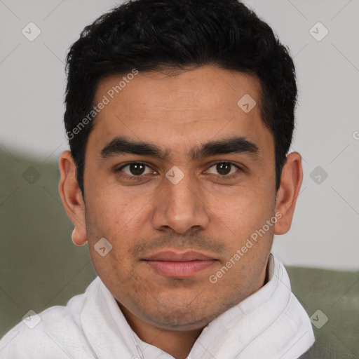 Joyful latino young-adult male with short  brown hair and brown eyes