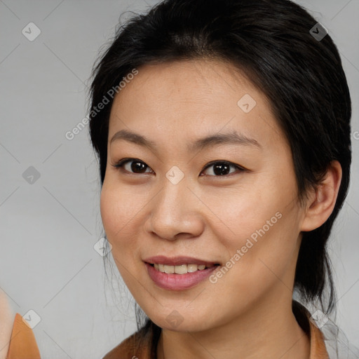 Joyful asian young-adult female with medium  brown hair and brown eyes