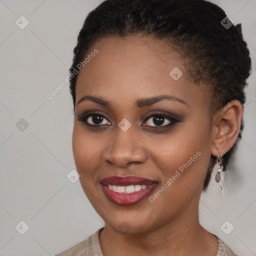 Joyful black young-adult female with short  brown hair and brown eyes