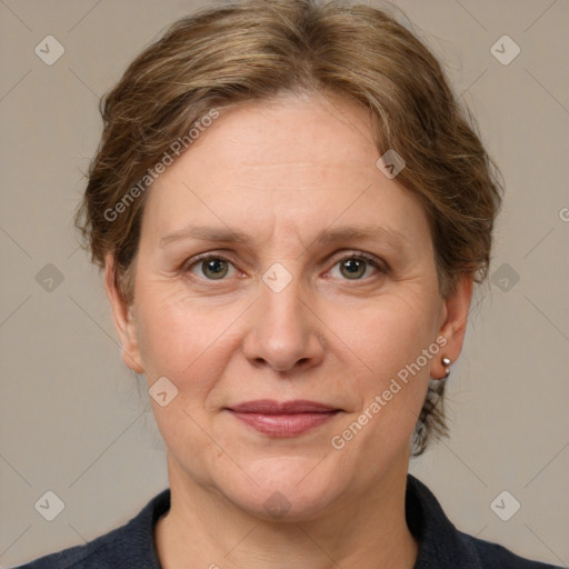 Joyful white adult female with medium  brown hair and grey eyes