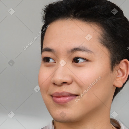 Joyful asian young-adult female with short  brown hair and brown eyes