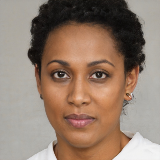 Neutral black young-adult female with short  brown hair and brown eyes