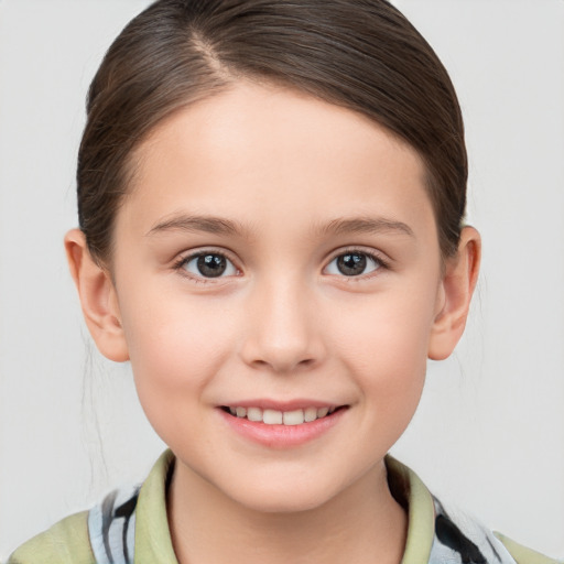 Joyful white child female with medium  brown hair and brown eyes