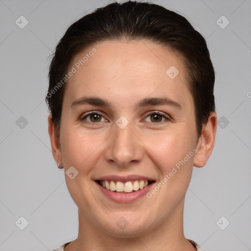 Joyful white young-adult female with short  brown hair and brown eyes