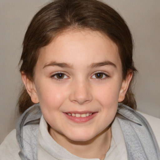 Joyful white child female with medium  brown hair and brown eyes