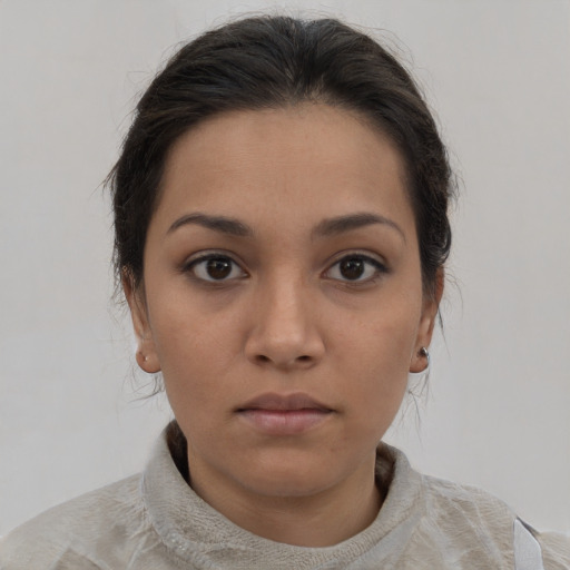 Neutral latino young-adult female with medium  brown hair and brown eyes