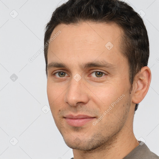 Joyful white young-adult male with short  brown hair and brown eyes