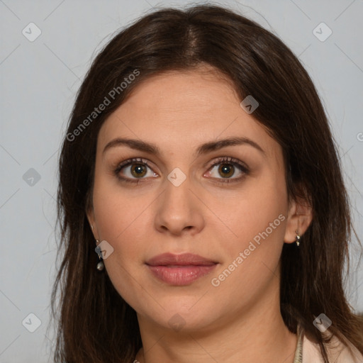 Joyful white young-adult female with long  brown hair and green eyes